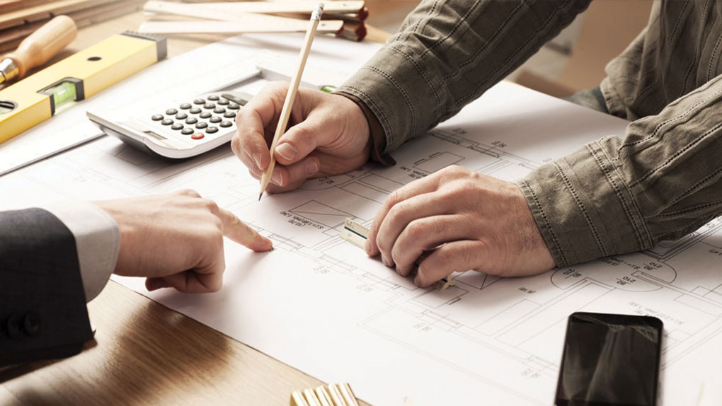 engineer working on plans